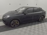 an image of a grey car parked in a garage