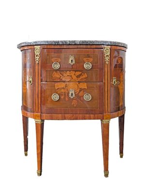 a small chest of drawers with a marble top