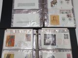 several different types of stamps are in a binder on a table