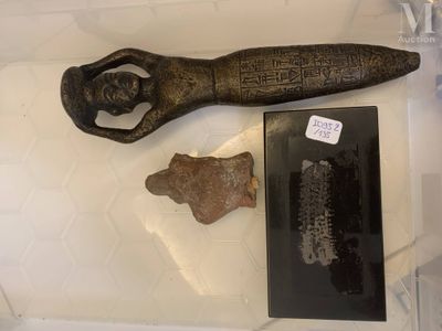 a glass case with a bottle opener and a knife in it