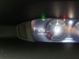 a close up of a car dashboard with the lights on
