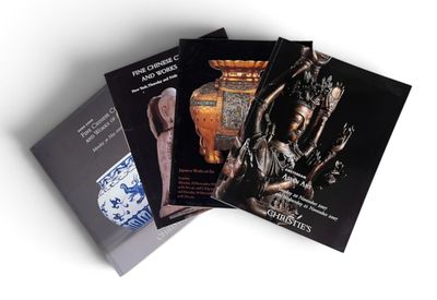 three books on a white background with a statue of a woman