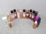 a lot of different bottles of perfume on a table