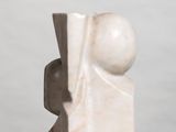 marble sculpture of a man and a woman on a white surface