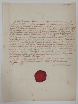 un gros plan d'une feuille de papier portant un cachet de cire