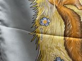 a pillow with a picture of a fox and flowers on it