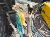 the back of a car with a bunch of wires in the trunk