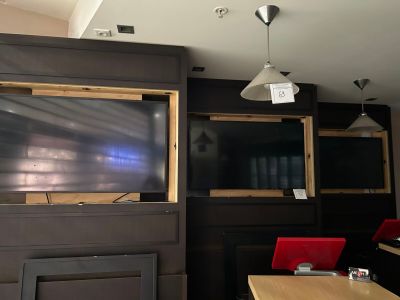 a large flat screen tv in the corner of a room