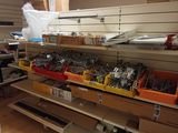 many different types of tools on the shelves in the shop