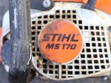a close up of a chainsaw with a sticker that says stihl ms770