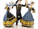 two figurines of a man and a woman dancing