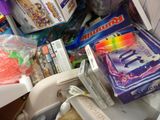 a pile of candy and candy bars in a refrigerator
