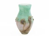 a green vase with a snake on it on a white background