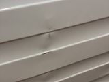a close up of a window with blinds on it