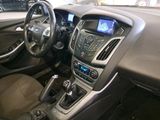 a dashboard of a car with a steering wheel and dashboard controls
