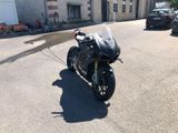 a motorcycle that is parked on the side of the street