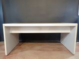 a white desk with a white top on a carpeted floor