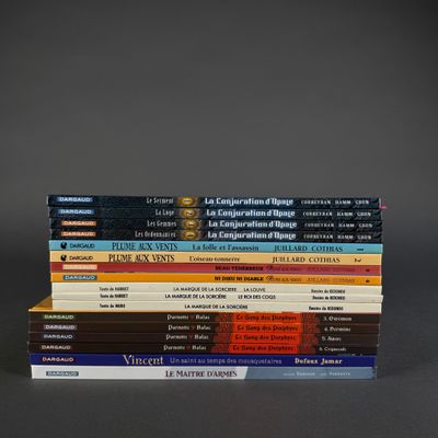 several books are stacked on top of each other on a table