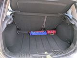 a trunk of a car with a bunch of items in it