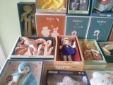 a lot of stuffed animals in the boxes on the floor