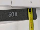 a ruler that is next to a keyboard on a desk
