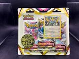 a close up of a box of pokemon cards on a black surface