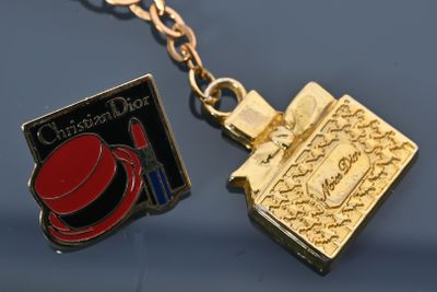 Christian DIOR Charm's en métal doré en forme de flacon de p…