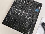 a dj mixer and a pair of headphones on a table