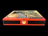 a box with a toy gun in it on a black background