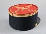 a black hat with a red and gold design on it