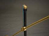 a close up of a lamp on a table with a black background