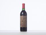 a bottle of wine that is sitting on a table