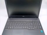 an open laptop computer sitting on top of a white table