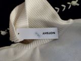 an image of a white shirt with a label on it