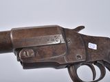 an old gun that is sitting on top of a table