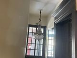 a light that is hanging from the ceiling in the hallway