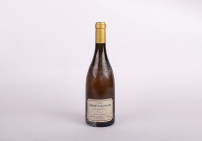 a bottle of wine that is sitting on a table