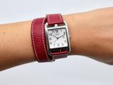 a woman ' s wrist that has a watch on it