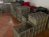many crates that are lined up on the floor