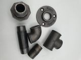 a close up of a couple of pipe fittings on a table