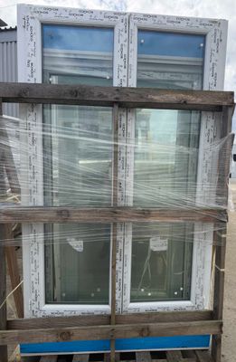 a picture of a pallet of windows in a warehouse