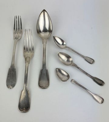 six silver spoons and a fork on a white surface