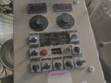 a control panel in the middle of a large machine