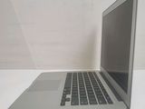 a laptop computer sitting on a table with a white background