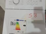 a white refrigerator with a label on it and a sticker attached to it