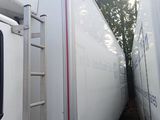 two trains that are parked next to each other