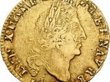 a gold coin with a woman ' s head and a crown on it