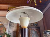 a lamp that is sitting on a table in a room