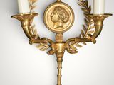 an image of a wall mounted candle holder with two candles