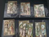 six cards with pictures of women and men on them on a table